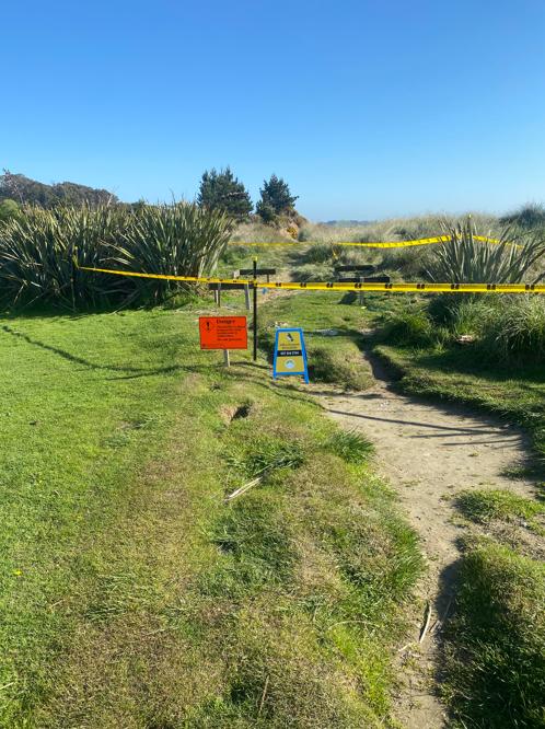 6 Moeraki DOC Moeraki Area where new information hut is to, close up of JDBuilders sign, area taped off to stop visitors walking through this section of the beach JDBuilders