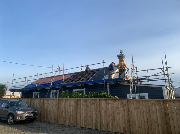 6 Pratt St Waikouaiti Taking off the old roofing right side with cover protecting roof from the weather JDBuilders