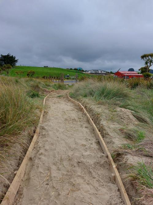 7 Moeraki DOC Moeraki Coming back from the beach along the winding path towards the new information hut being constructed and the carpark JDBuilders