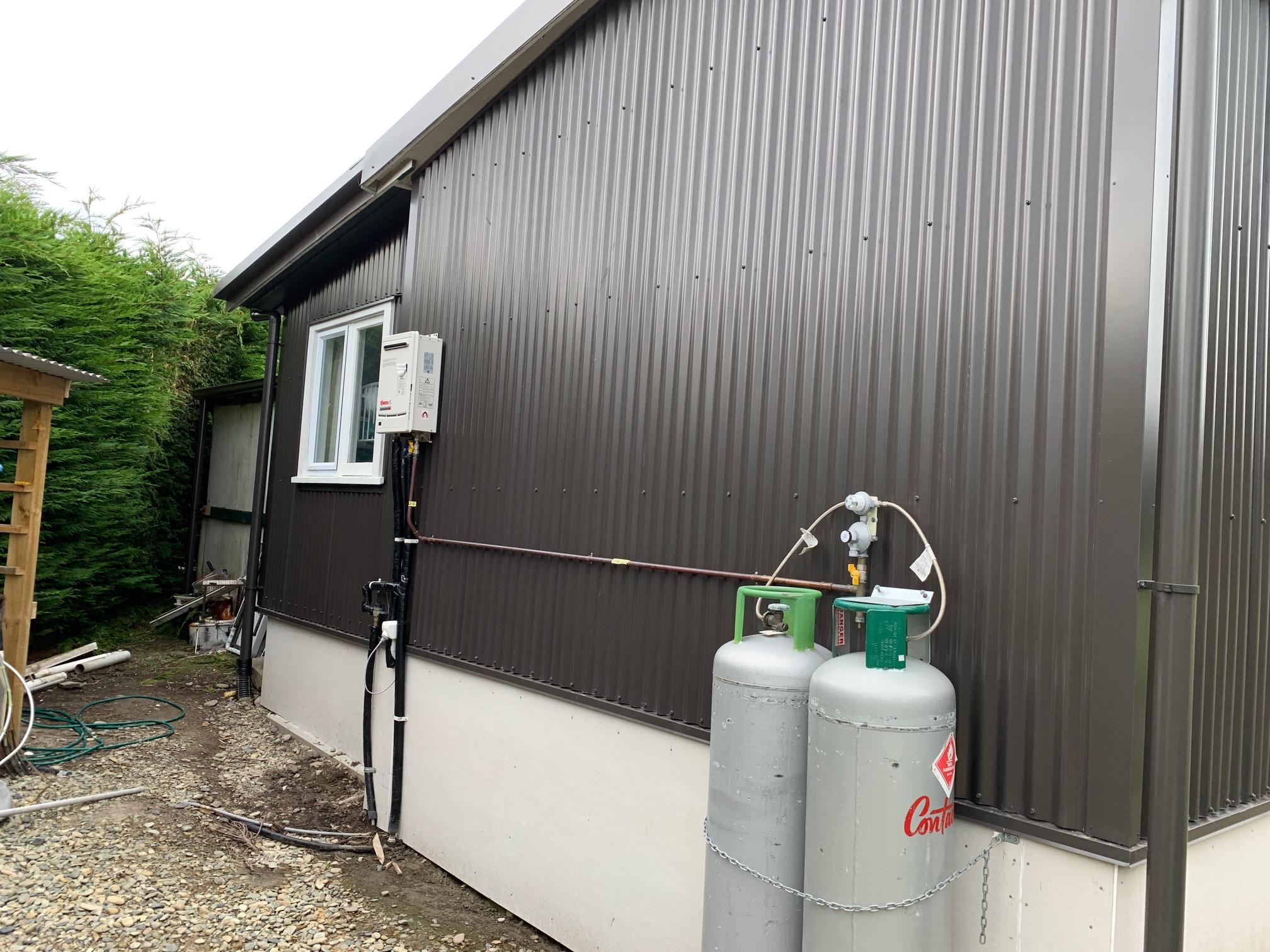 Semple Street Kakanui Renovation using MagnaFlow corrugate as cladding side of house with gas bottles JDBuilders 4