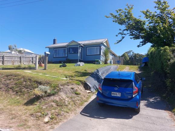 10 13 Beach Street, Waikouaiti Gorious day to start building the clients new fence, front of the property with one of their cars in the driveway JDBuilders