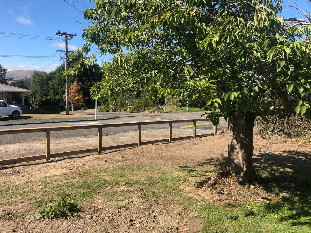 3 30 Kirkwall St, Palmerston View of the new fence inside the property looking out towards the street with a lovely tree in the foreground JDBuilders