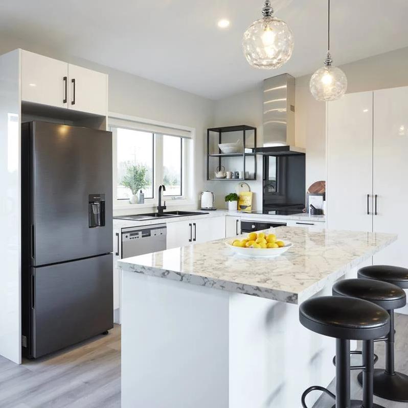 3 Angus Clever Living Homes View of the kitchen with the benchtop in the foreground JDBuilders