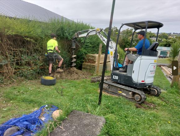 6 13 Beach Street, Waikouaiti Strings lined and holes for posts marked out, two of our team working with Phil on the digger and Kurt watching the auger bit JDBuilders