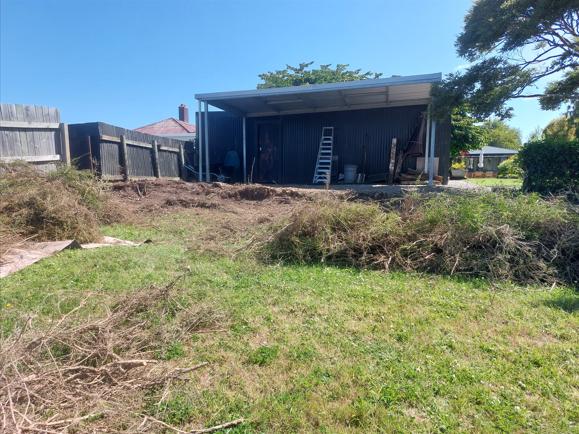 9 13 Beach Street, Waikouaiti Back of the property with the old hedge cleared away looking into the neighbours carport JDBuilders