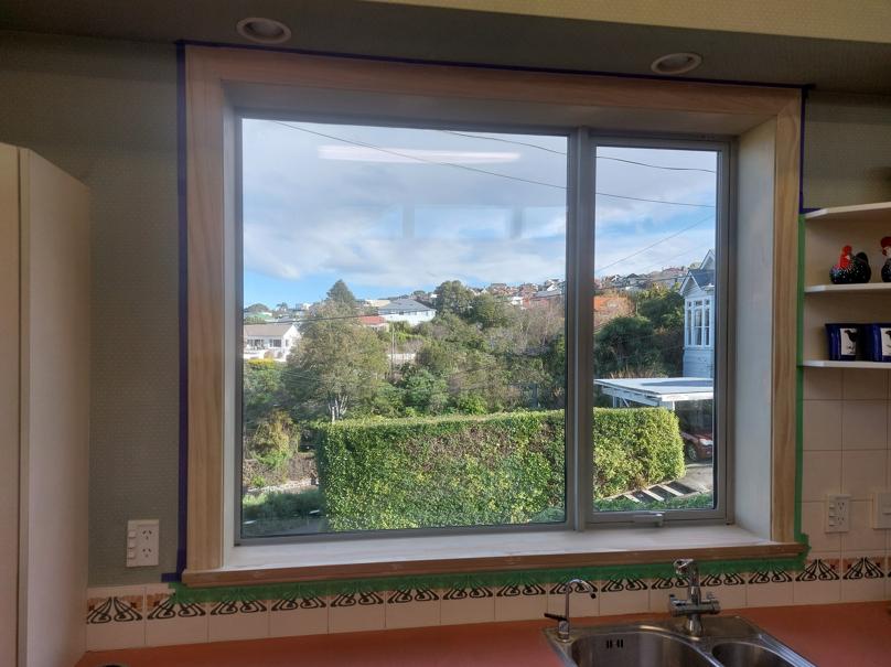 6 19 Tweed St Roslyn, Dunedin Newly installed double glazed window in the kitchen being masked ready for painting JDBuilders