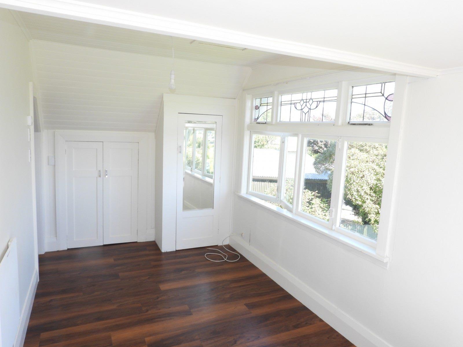 9 66 Norwich St, Hampden Third bedroom showing the new flooring after renovstion JDBuilders