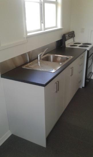 2 Auskerry St Palmerston Side on view of the newly installed kitchen in the investment property JDBuilders