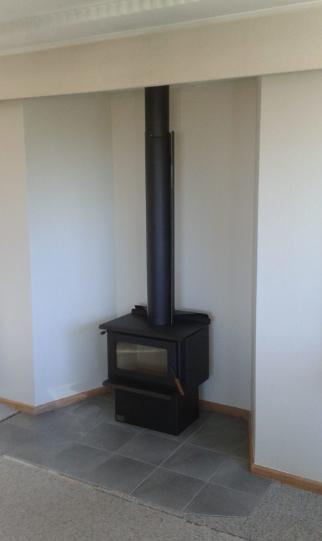2 Derwent St Oamaru Side on view of the completed new fireplace after removing the Wanaka stone JDBuilders
