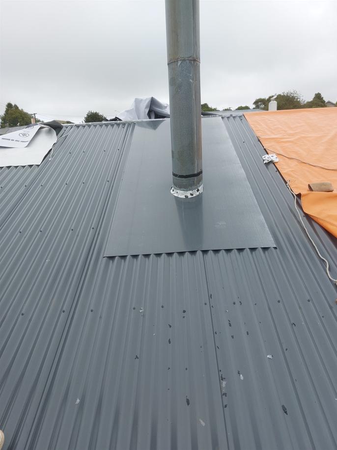9 254 Brockville Rd, Brockville, Dunedin New flashing installed around the flue on the new roof JDBuilders