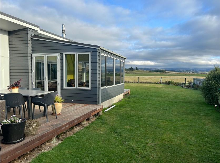 1 Side on view of the newly built conservatory in Karitane showing off the views looking south towards Dunedin JDBuilders