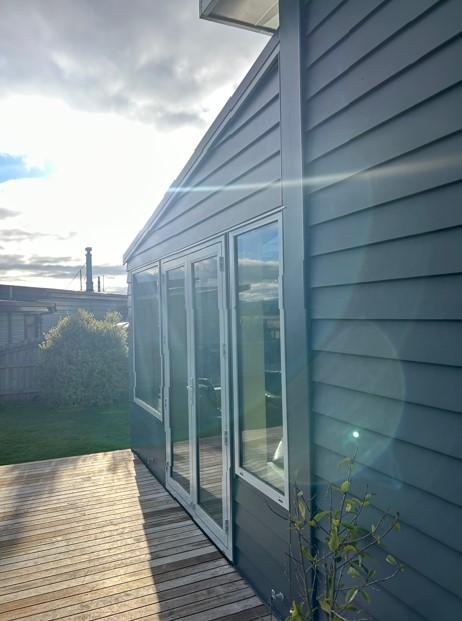 12 Side view of the newly built conservatory from the South with the sun setting JDBuilders