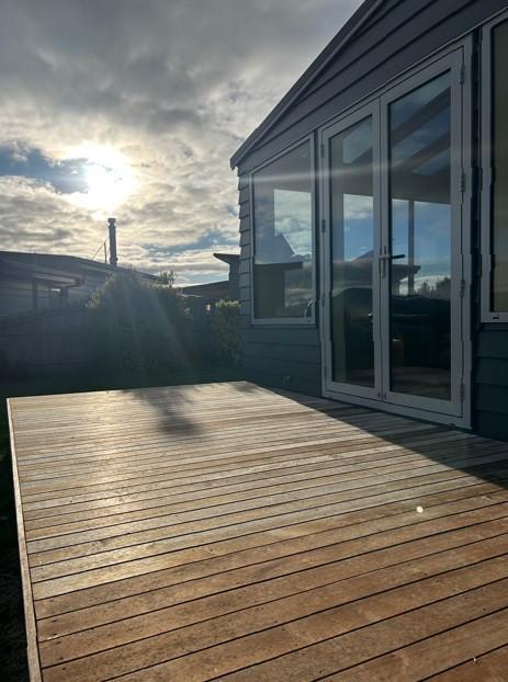 13 End of another beautiful day in Karitane, showing off the new conservatory and old decking in the foreground JDBuilders