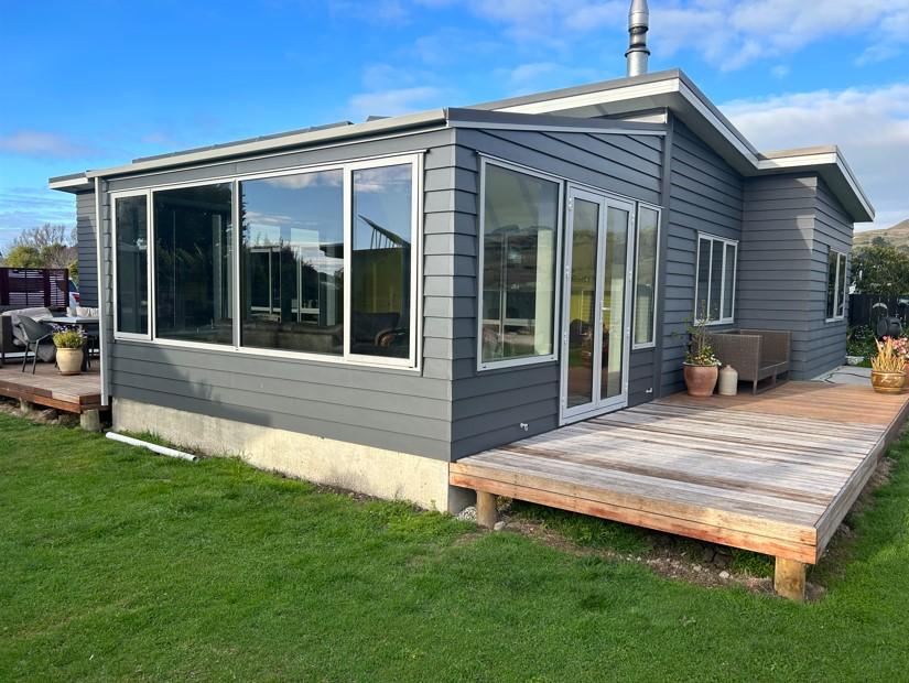 4 View of the new conservatory and door from the south side which meets up with the old decking JDBuilders