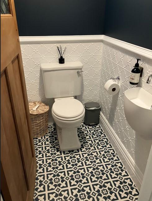 4 426 Herbert Rd, Herbert The completed new powder room with new toilet, vanity, tiles, pressed tin feature wall and skirting JDBuilders